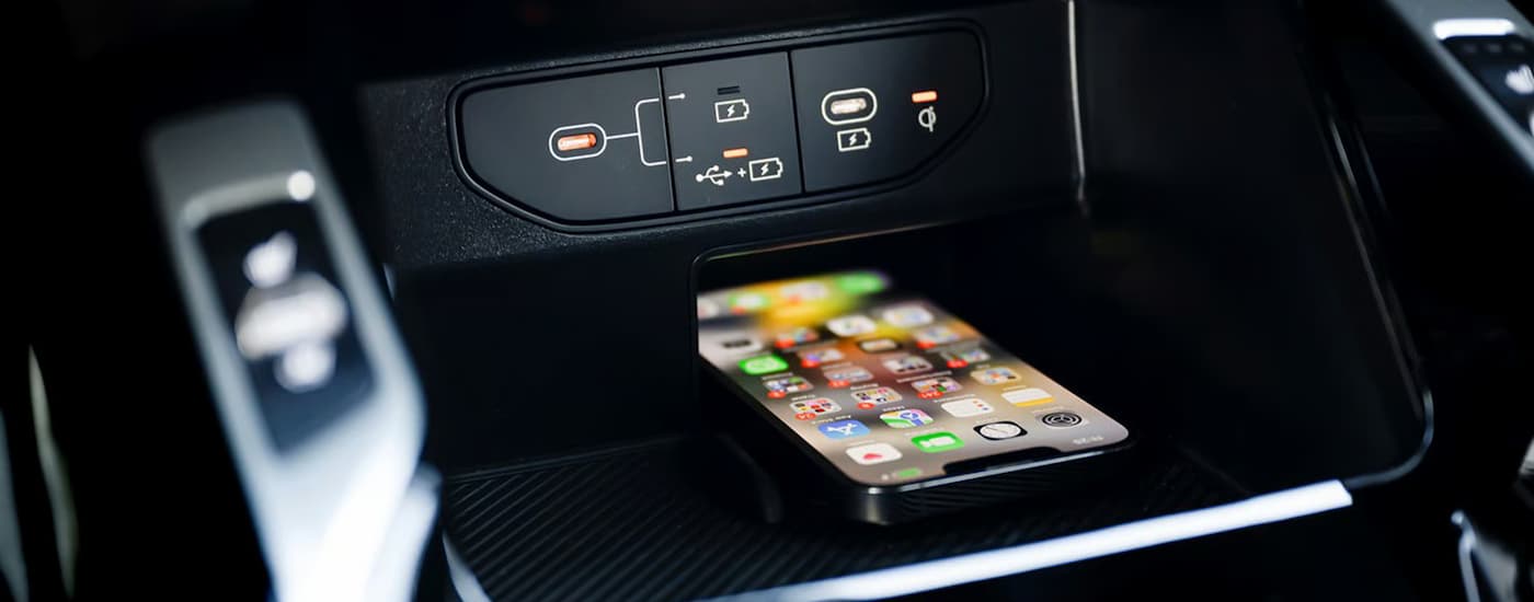 Cellphone in the center console of a 2026 Kia Sorento