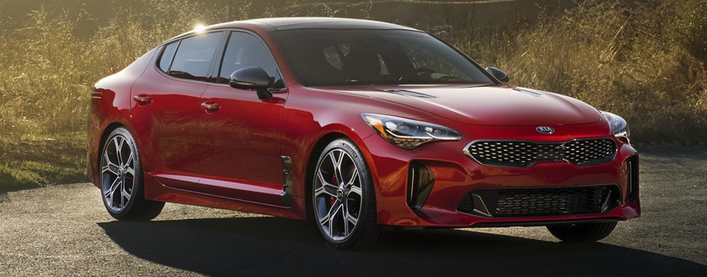 A red 2020 Kia Stinger from the front at an angle after leaving a dealer that has a used Kia for sale near Blue Springs.